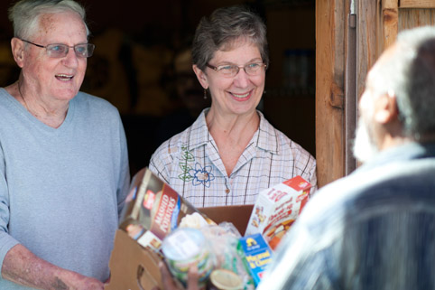 volunteer delivering food shp